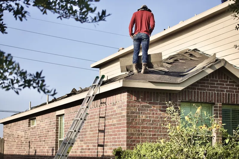 Professional roofer working on a residential roof in Skokie Highlands